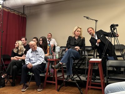 Group of people enjoying a live music performance in an intimate setting.