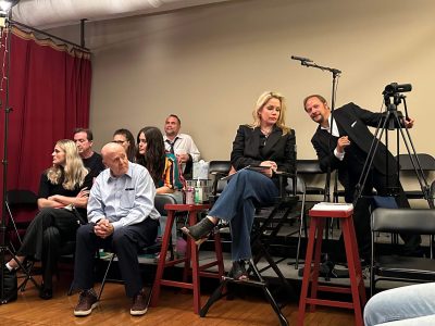 Group of people enjoying a live music performance in an intimate setting.