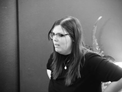 Black-and-white portrait of woman with glasses